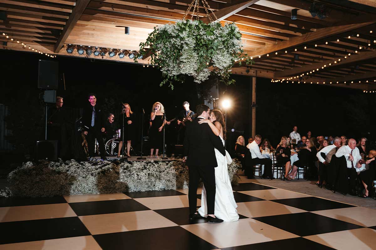 Newlyweds first dance with Society Hill musical entertainment and custom florals by Foreman Productions