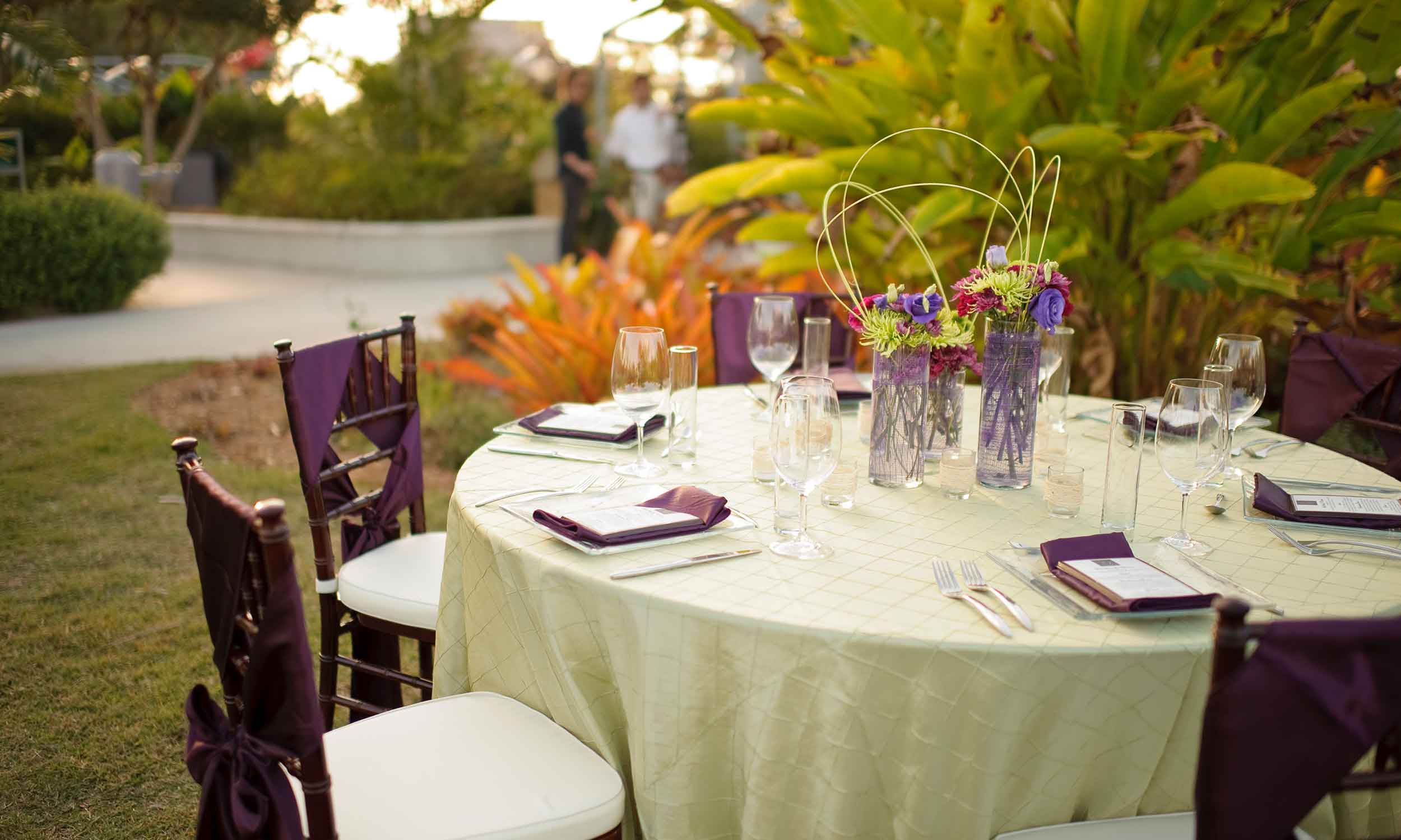 Outdoor seating and table setting at a corporate event in Naples, Florida