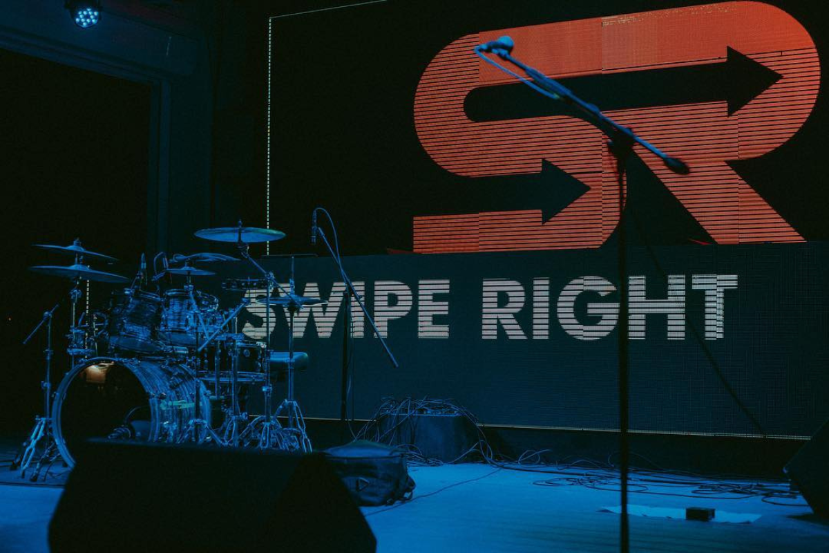 Swipe Right band onstage playing an event