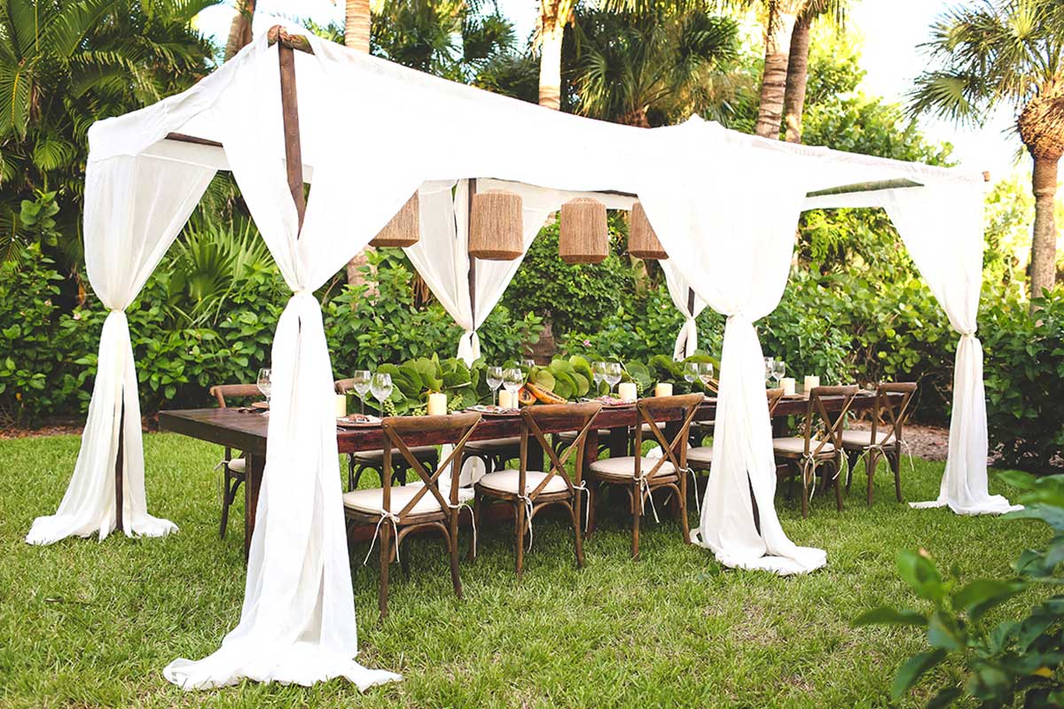 Tropical Polynesian tablet setting for outdoor wedding reception in Sanibel Florida